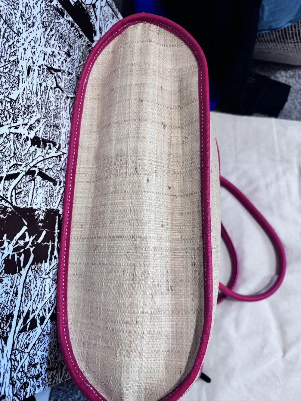Tory Burch straw tote features vibrant red leather stripes